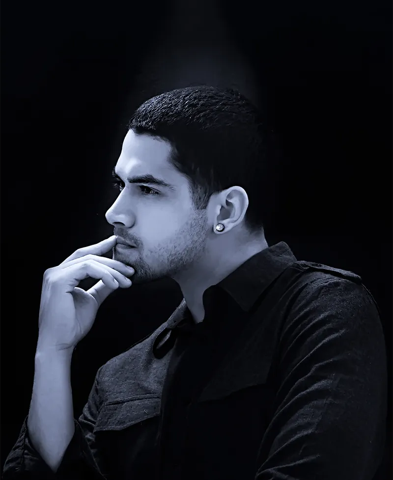 Personal branding profile portrait of a man in dramatic low-key lighting