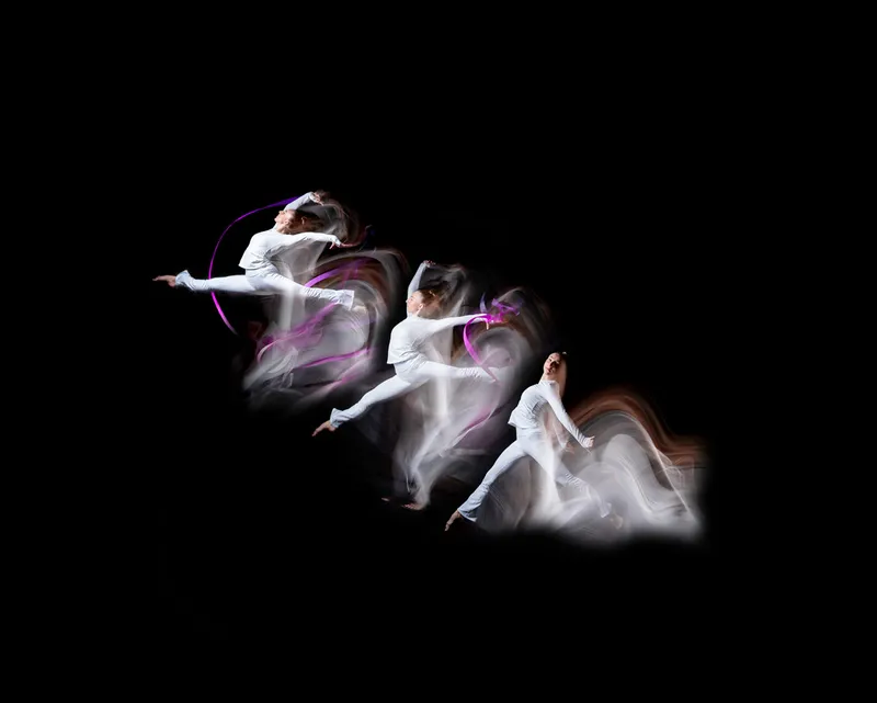 Rhythmic gymnast ribbon motion composite blending several moments of one routine into a single frame